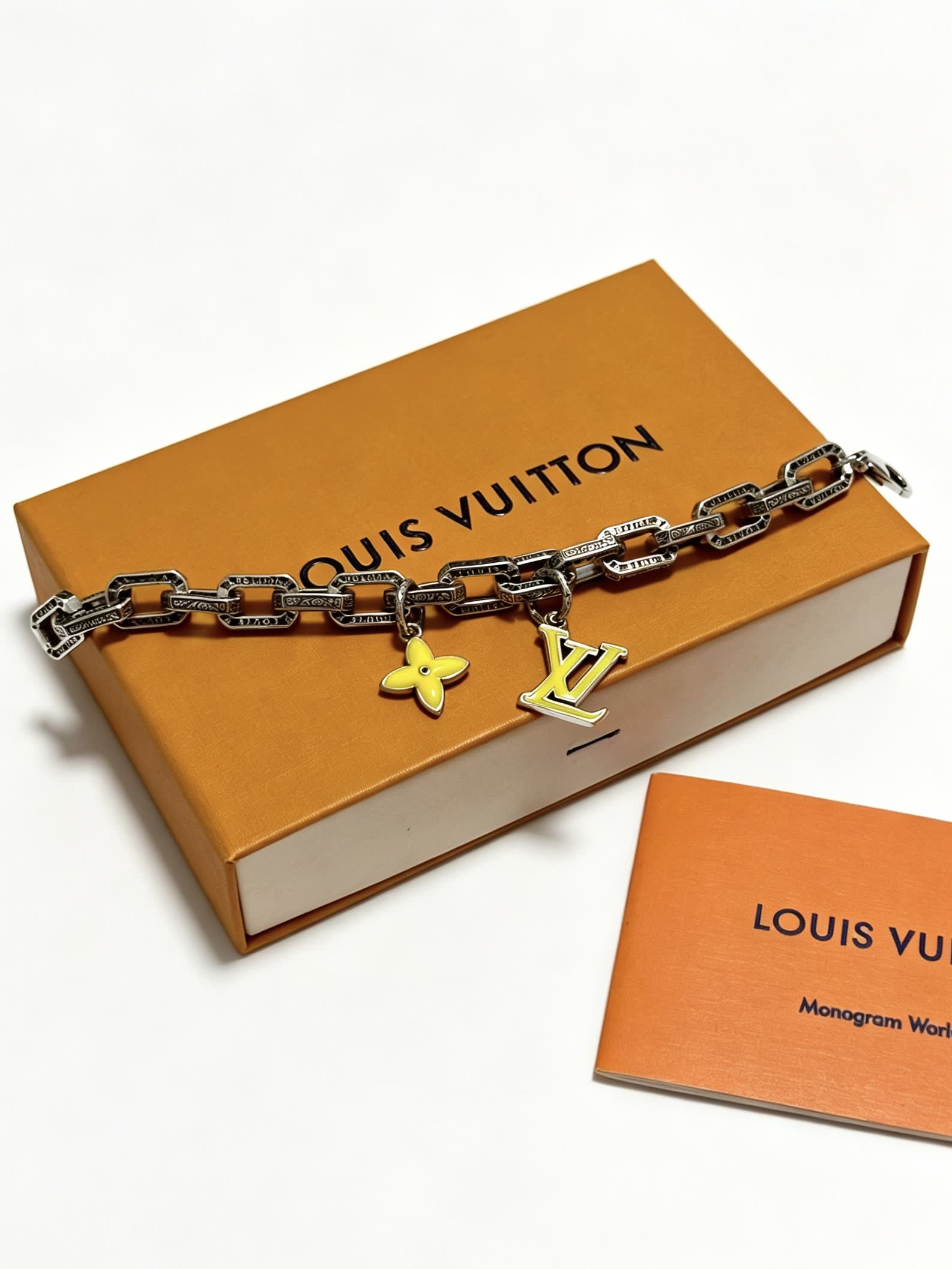Louis Vuitton Silver Bracelet with LV Logo and Flower Charm
